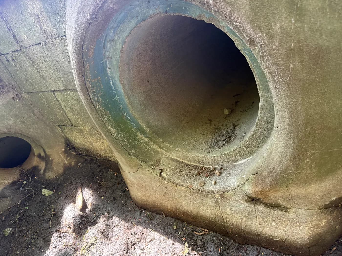 Large aging concrete utility chamber exposed during an underground infrastructure upgrade