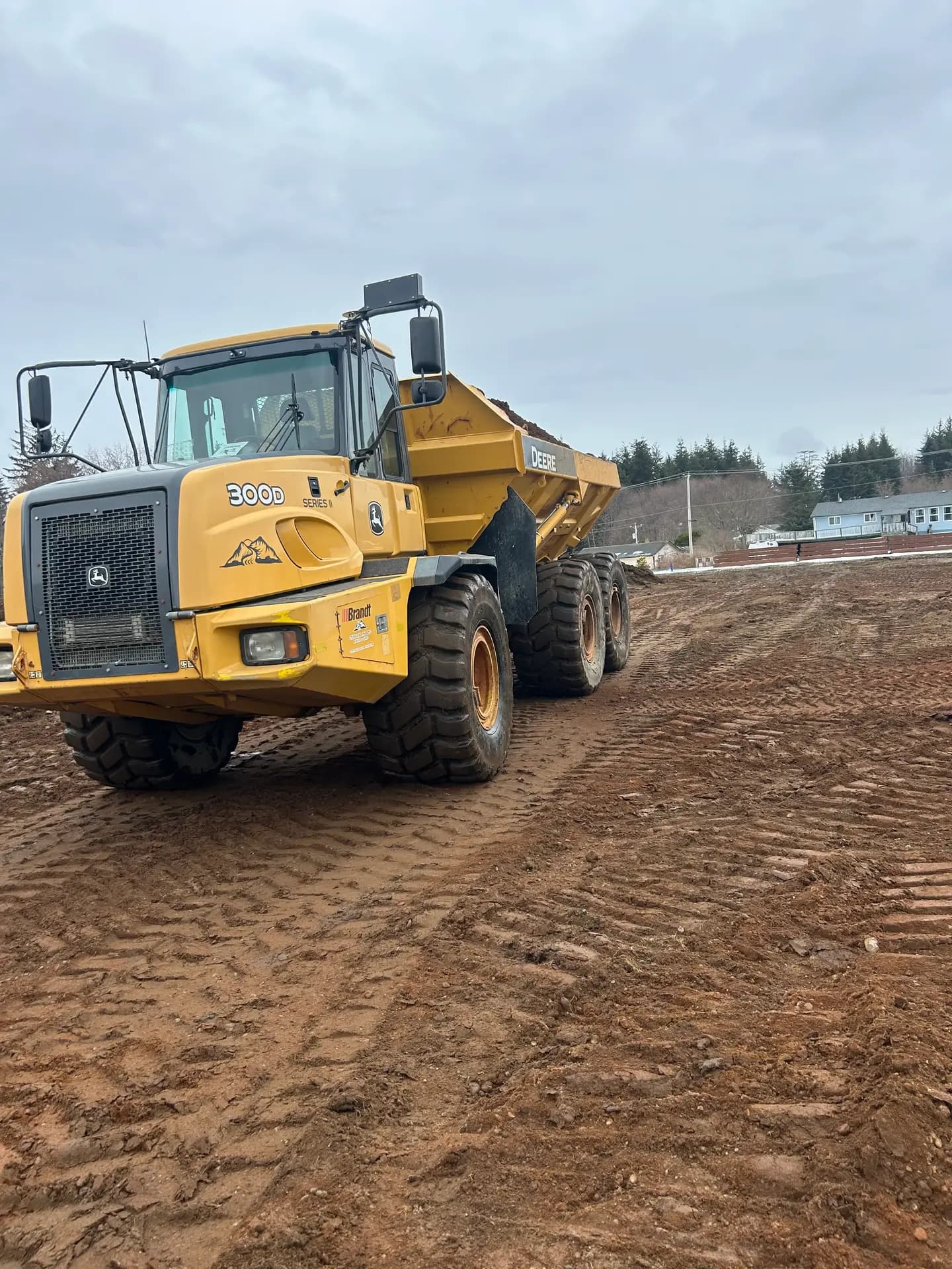 John Deere articulated rock truck on a BC mass excavation site