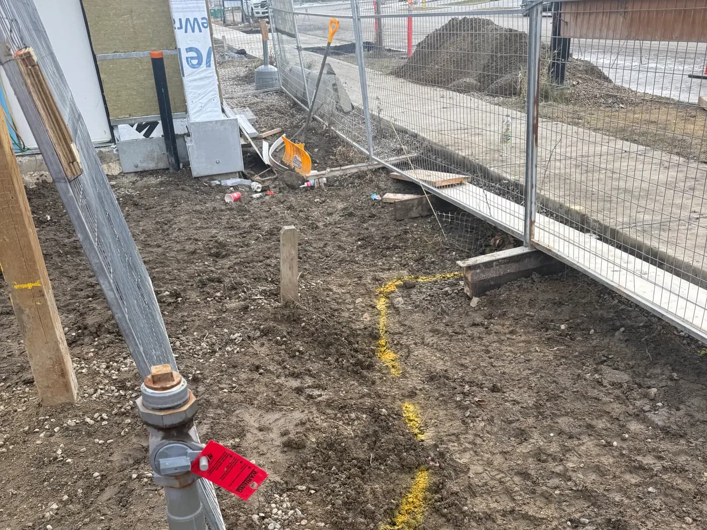 Water service riser with tracer wire and marked utility line on a rural installation